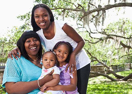 Adoptive mother with her children and their birth mom