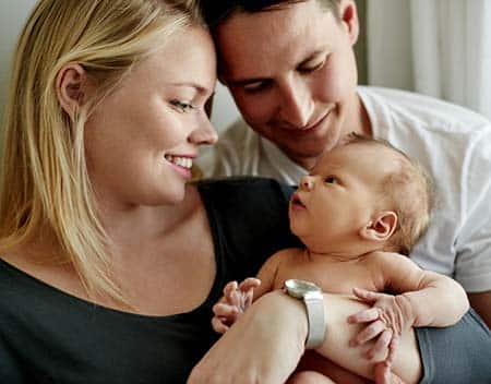 adoptive couple with baby