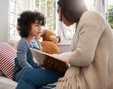 mom reading an adoption book for kids